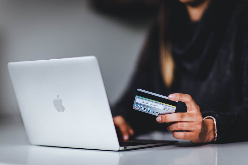 A woman entering her debit card details while transacting online