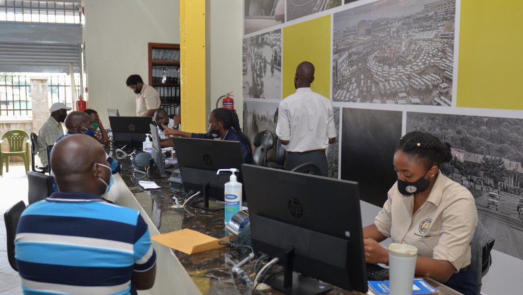 UDLS staff attending to clients at the main branch in Kampala